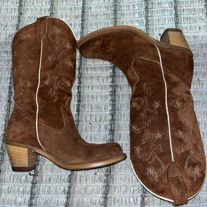 Cowboy Boots! The outside is made out suede with white flower embroidery details